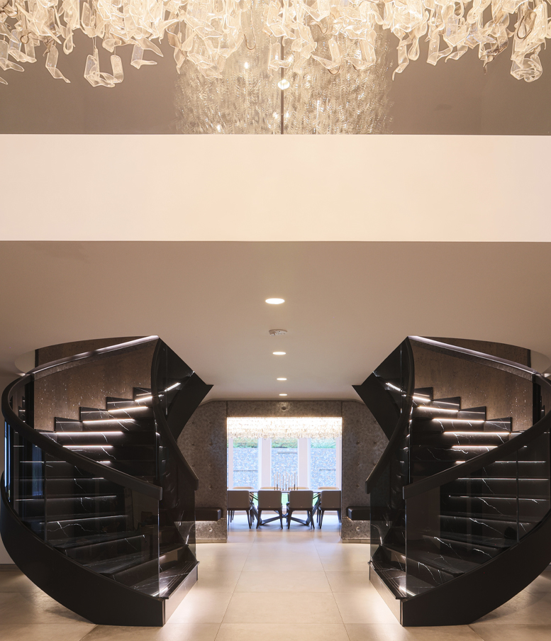 Grand modern staircase designed by high-end Interiors London based Moderno Interiors. Image is sample of work that links to full list of Moderno Interiors Portfolio.